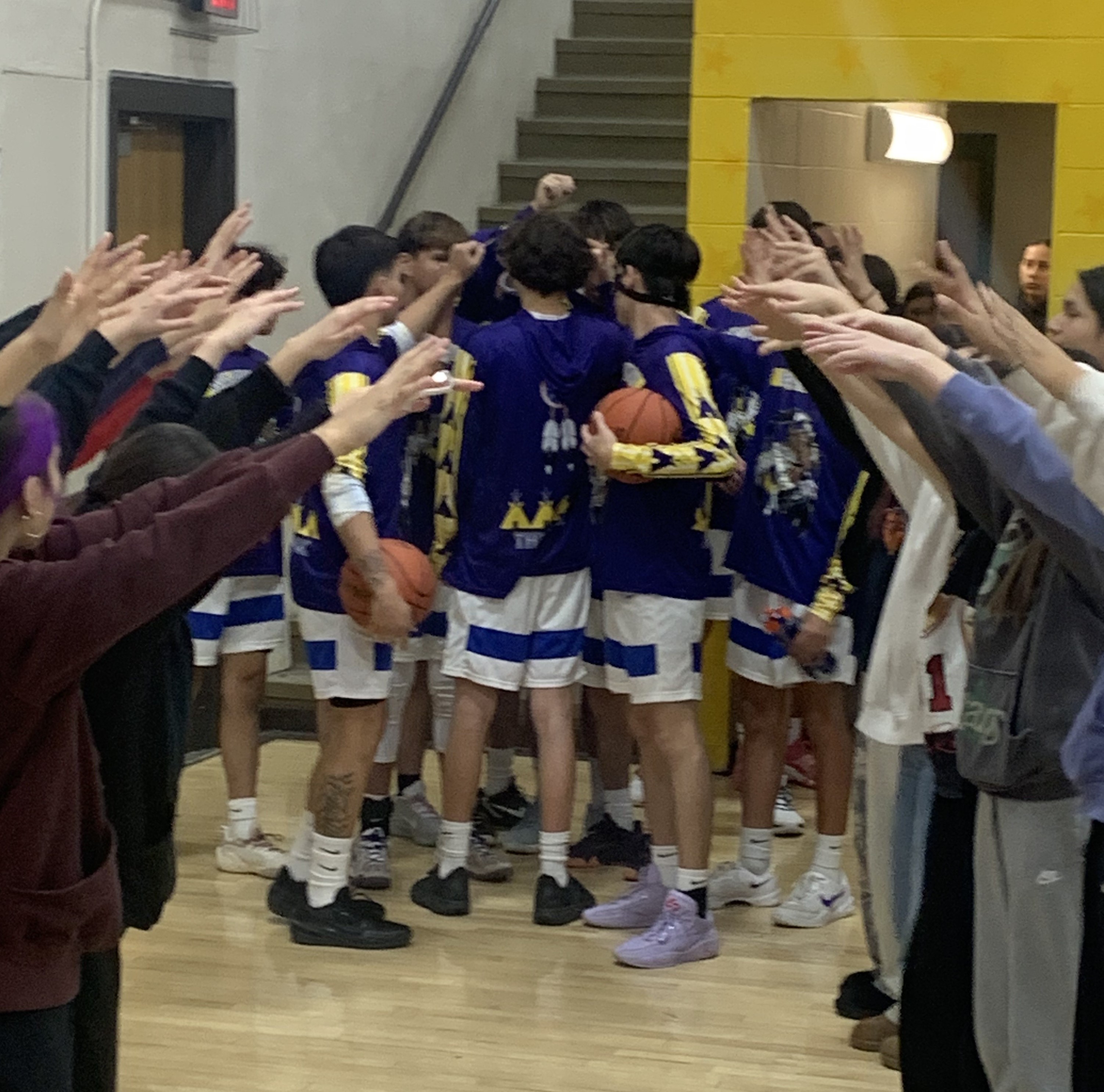 Warrior Basketball Team huddle